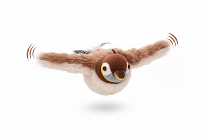 Cat playing with a bird-shaped toy labeled 'Flaps and Chirps' on a light background.